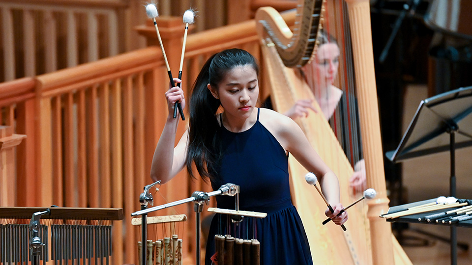 A student playing the marimba in the Amaryllis Fleming Concert Hall